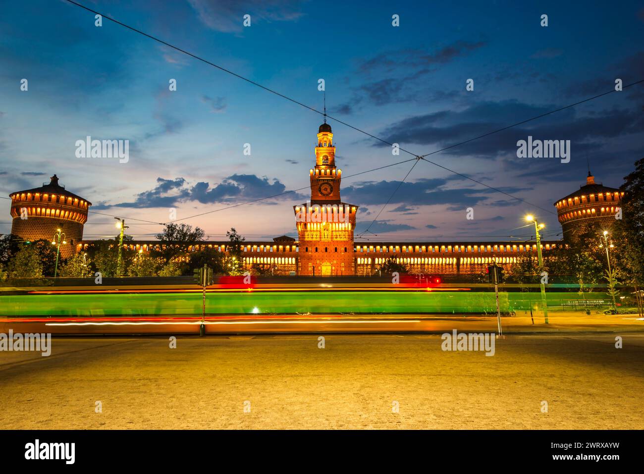 Sforzesco Castle and tram in the evening, Milan, Italy Stock Photo