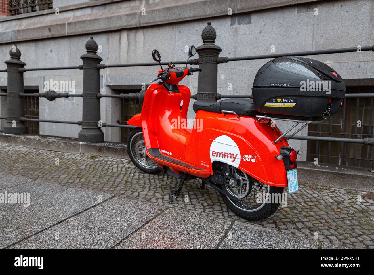 Berlin, Germany - 16 DEC 2021: Emmy rental motorbike parked on a sidewalk in Berlin, Germany. Stock Photo