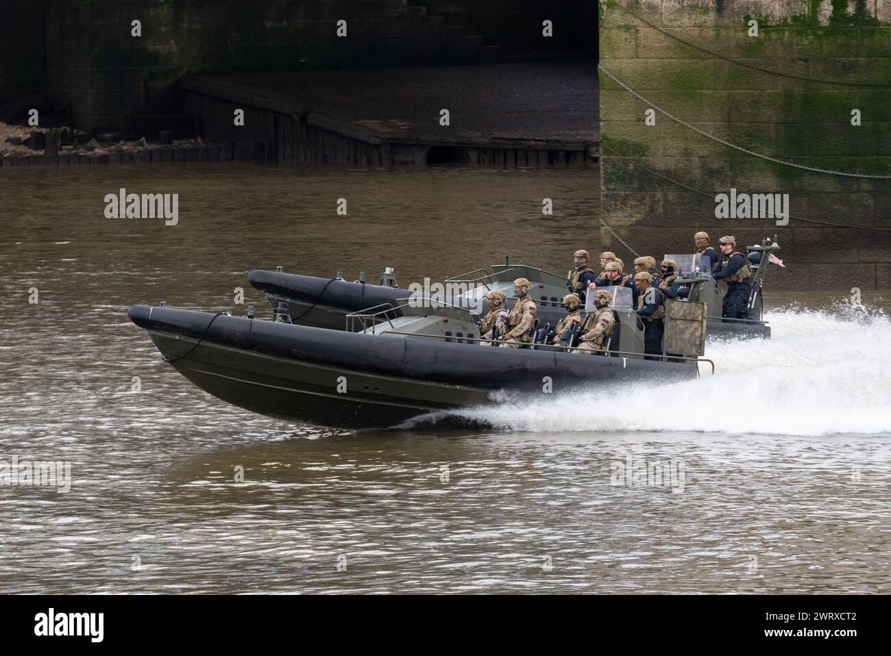 Royal Marines Commandos taking part in Constable's Dues traditional event by the Tower of London, UK. Riding in Offshore Raiding Craft on River Thames Stock Photo