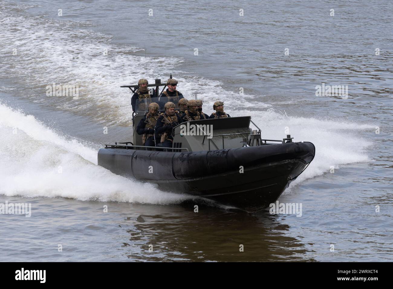 Royal Marines Commandos taking part in Constable's Dues traditional event by the Tower of London, UK. Riding in Offshore Raiding Craft on River Thames Stock Photo