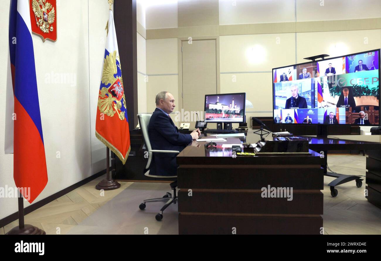 Novo-Ogaryovo, Russia. 14th Mar, 2024. Russian President Vladimir Putin joins a video conference to launch the construction of Unit 7 at Leningrad Nuclear Power Plant and a high-speed railway line between Moscow and St. Petersburg from the official presidential residence, March 14, 2024 in Novo-Ogaryovo, Russia. Credit: Mikhail Metzel/Kremlin Pool/Alamy Live News Stock Photo