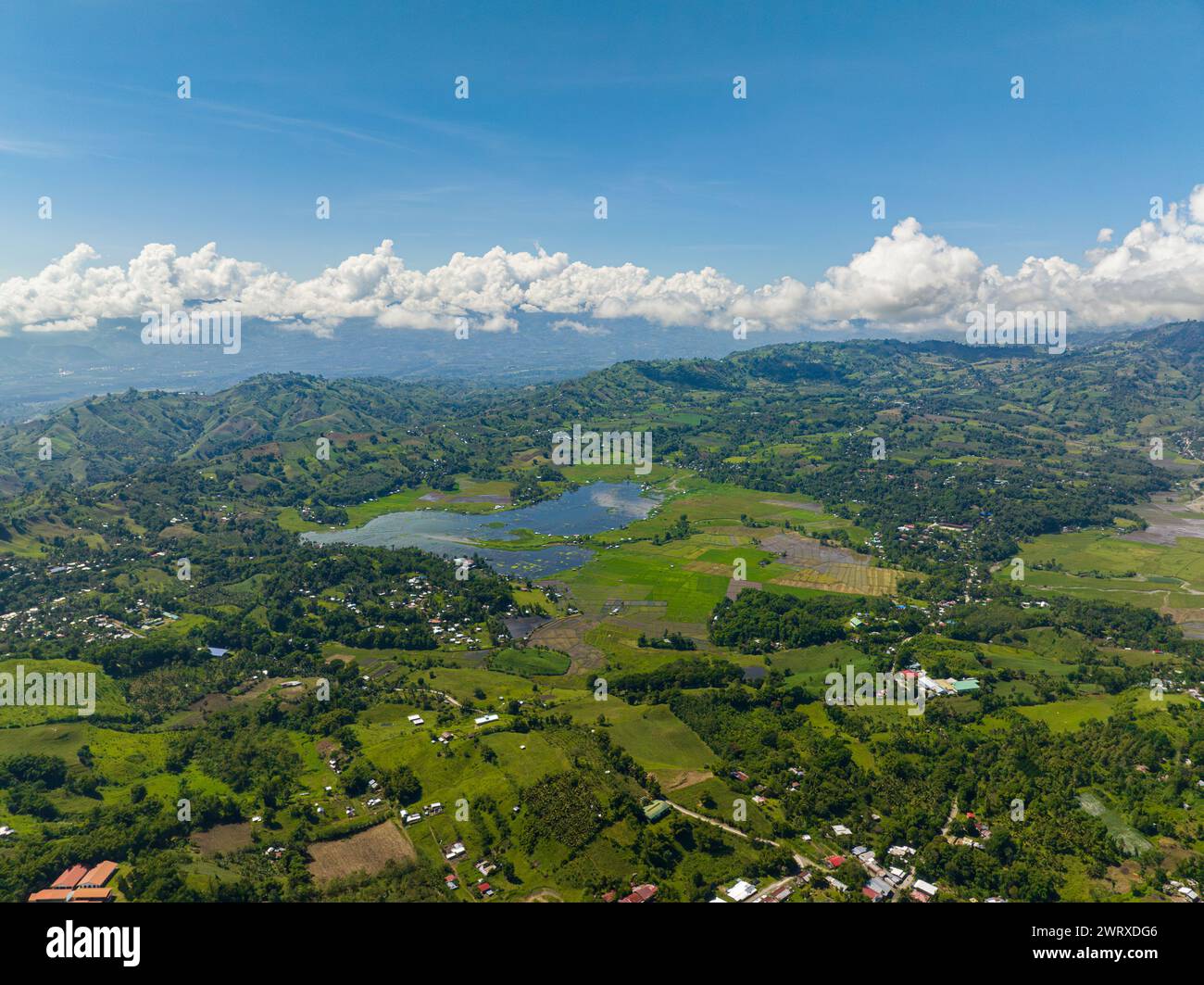 Lake Seloton surrounded by agricultural land and mountain rainforest. Lake Sebu. Mindanao, Philippines. Stock Photo