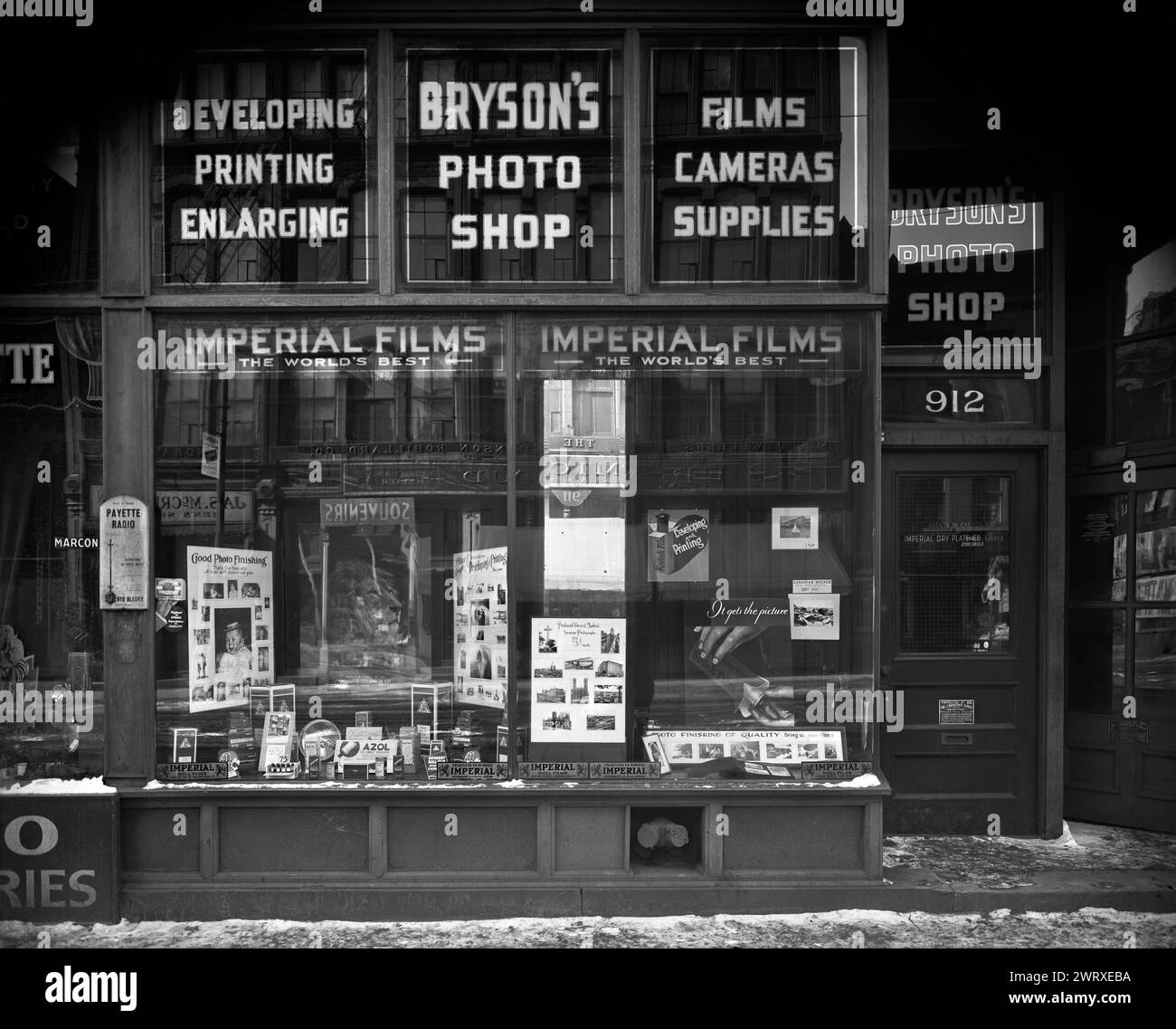 Window display of the Bryson photo store, rue Bleury Street, Montreal, QC, canada 1932-1933.  Vintage Street Photography photo by Wm. Notman & Son Stock Photo