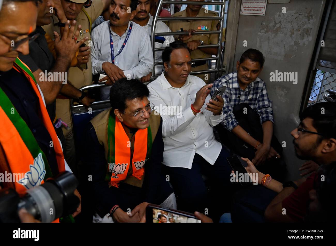 Mumbai, India. 14th Mar, 2024. MUMBAI, INDIA - MARCH 14: Piyush Goyal, Minister of Textiles, Minister of Commerce and Industry and Minister of Consumer Affairs, Food and Public Distribution shares the light moment with co-passenger while traveling between Dadar Railway Station to Borivali Railway Station in 2nd Class compartment, during evening peak hours at Dadar Station, on March 14, 2024 in Mumbai, India. (Photo by Anshuman Poyrekar/Hindustan Times/Sipa USA ) Credit: Sipa USA/Alamy Live News Stock Photo