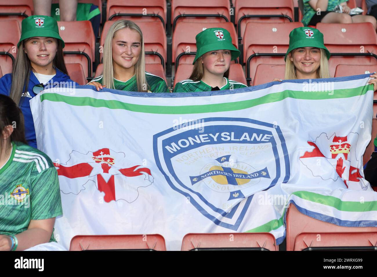 Fans with Moneyslane flag NI Northern Ireland v Norway UEFA Women's Euro St Mary's Stadium, Southampton Stock Photo