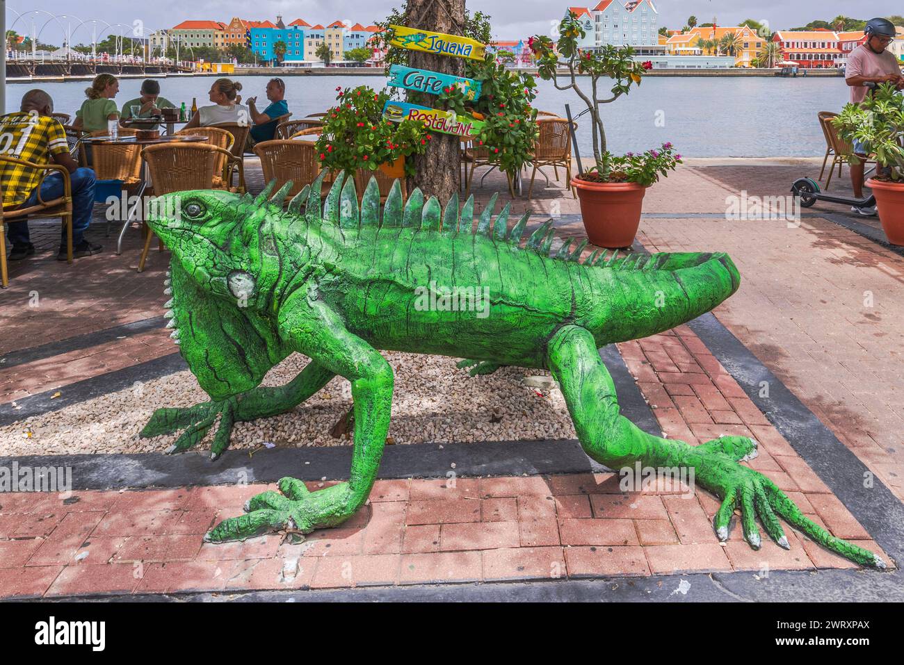 Close-up view of an iguana figure  in front of the restaurant entrance. Curacao. Willemstad. Stock Photo