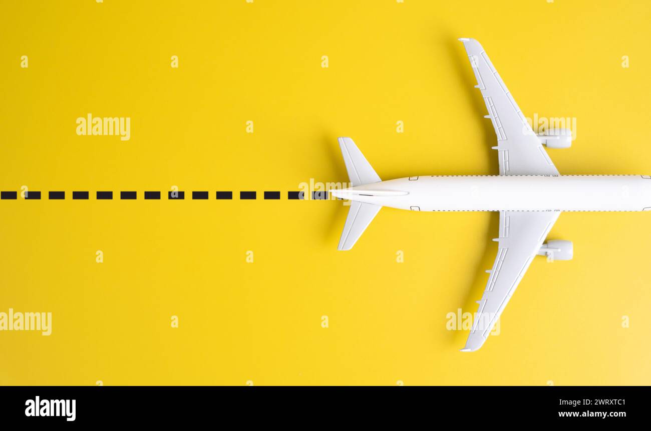 Passenger plane airliner leaves a dotted line. Air traffic control. Popular travel destinations. Search for cheap tickets. Destination hit on holidays Stock Photo