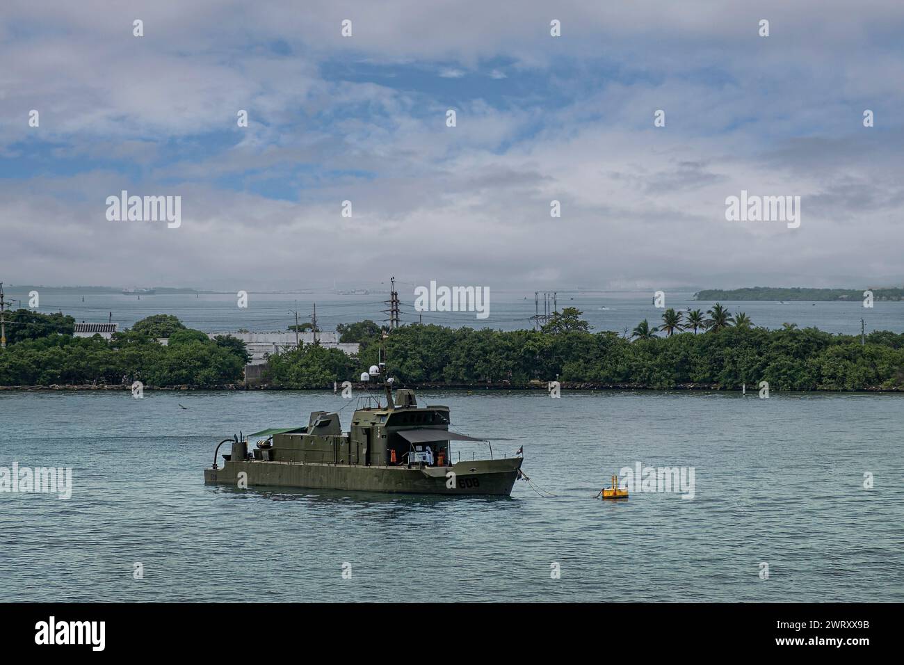 Cartagena, Colombia - July 25, 2023: Green Cpcim patrol boat 608 of national navy, closeup of bahaia, bay, with isla Manzanillo green peninsuala in ba Stock Photo