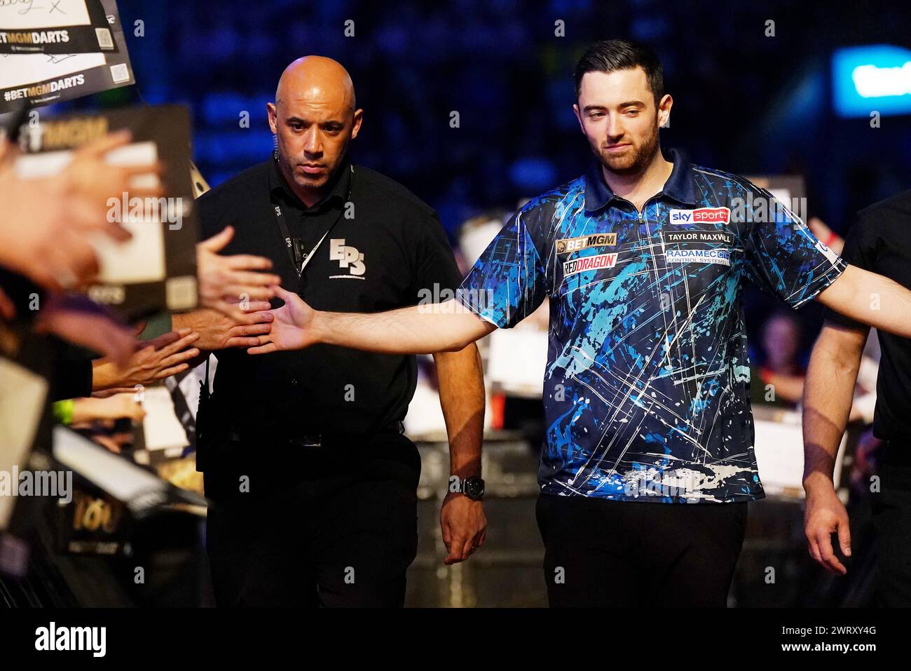 Luke Humphries walks out to play Peter Wright (not pictured) on night