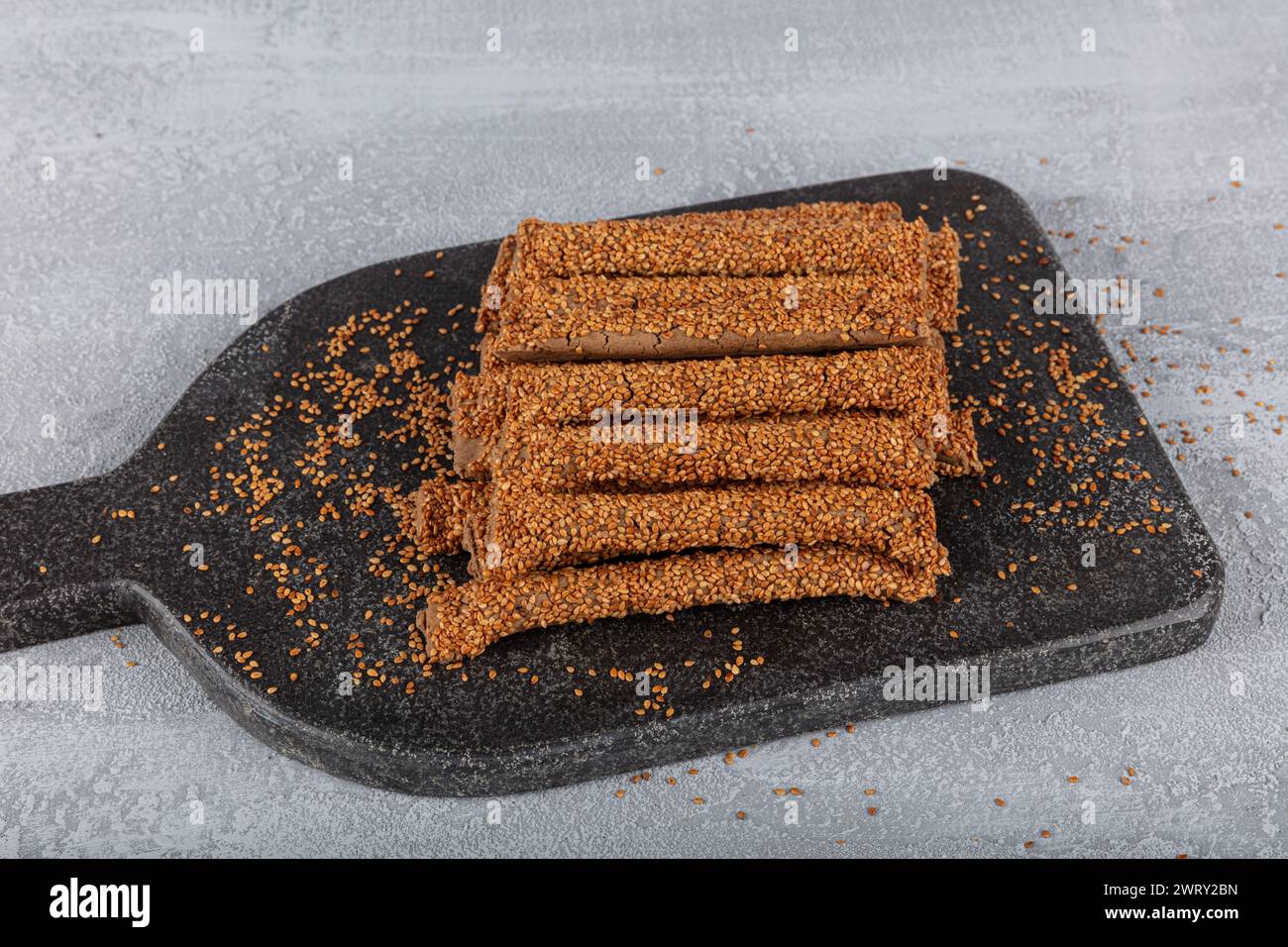 Sesame stick crackers, crispy bread straw. Pretzel bread sticks with sesame seeds, snacks Stock