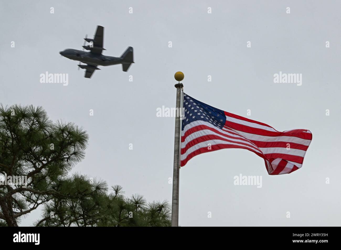 An AC-130J Ghostrider gunship assigned to the 16th Special Operations Squadron flies over the Air Park during the Jockey-14 Remembrance Ceremony at Hurlburt Field, Florida, Mar. 14, 2024. The flyover represented the continuing legacy of Jockey-14 and honored the fallen following Air Commando tradition. (U.S. Air Force photo by Senior Airman Ty Pilgrim) Stock Photo