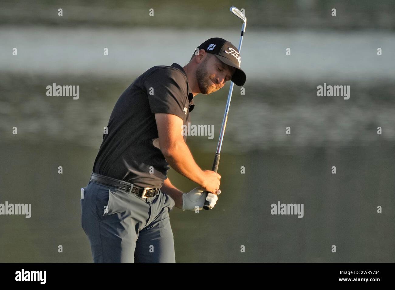 Wyndham Clark reacts to his shot on the 18th fairway during the first