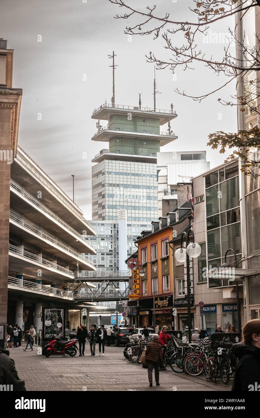Picture of the Telekom Hochhaus seen from An sankt Agatha street in the city center of Cologne with pedestrians walking. Stock Photo