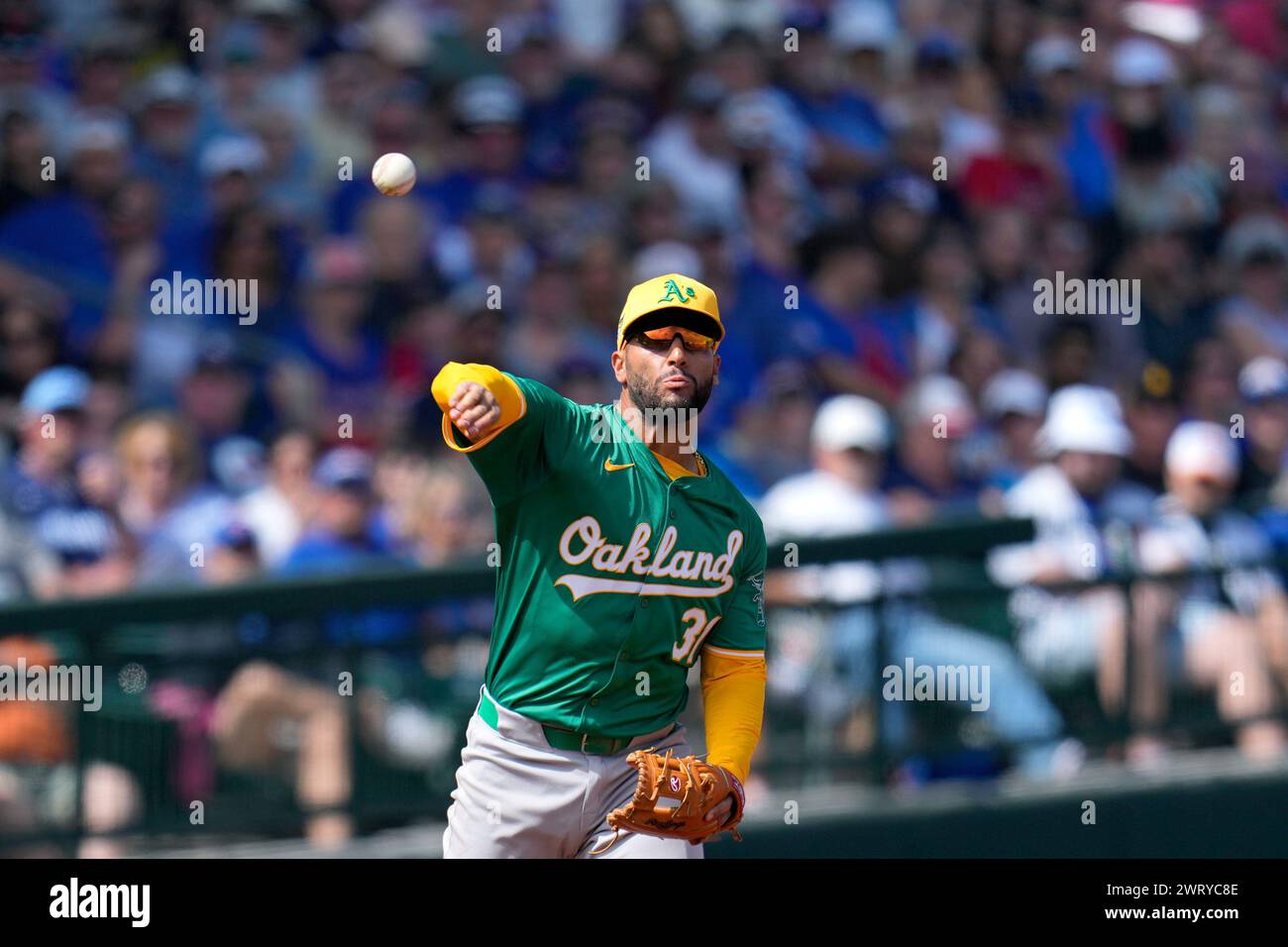 Oakland Athletics third baseman Abraham Toro throws to first base for ...
