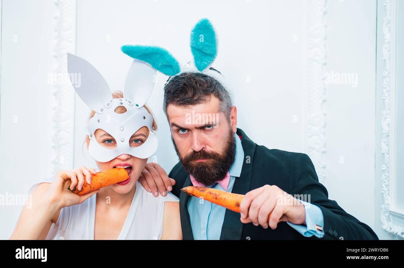 Respect traditions. Happy easter day. Bunny rabbit man and girl eat ...