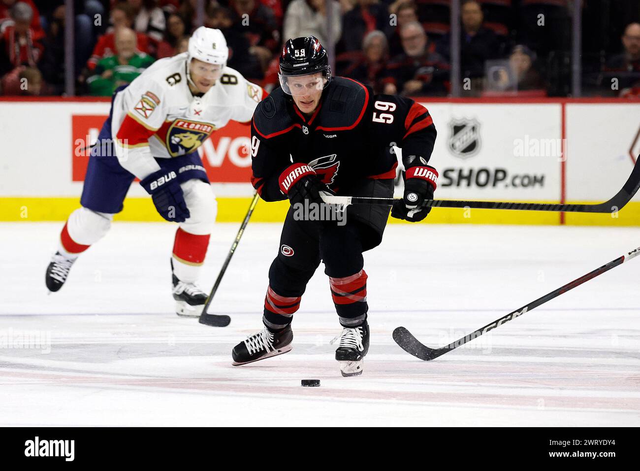 Carolina Hurricanes' Jake Guentzel (59) Controls The Puck Against The ...