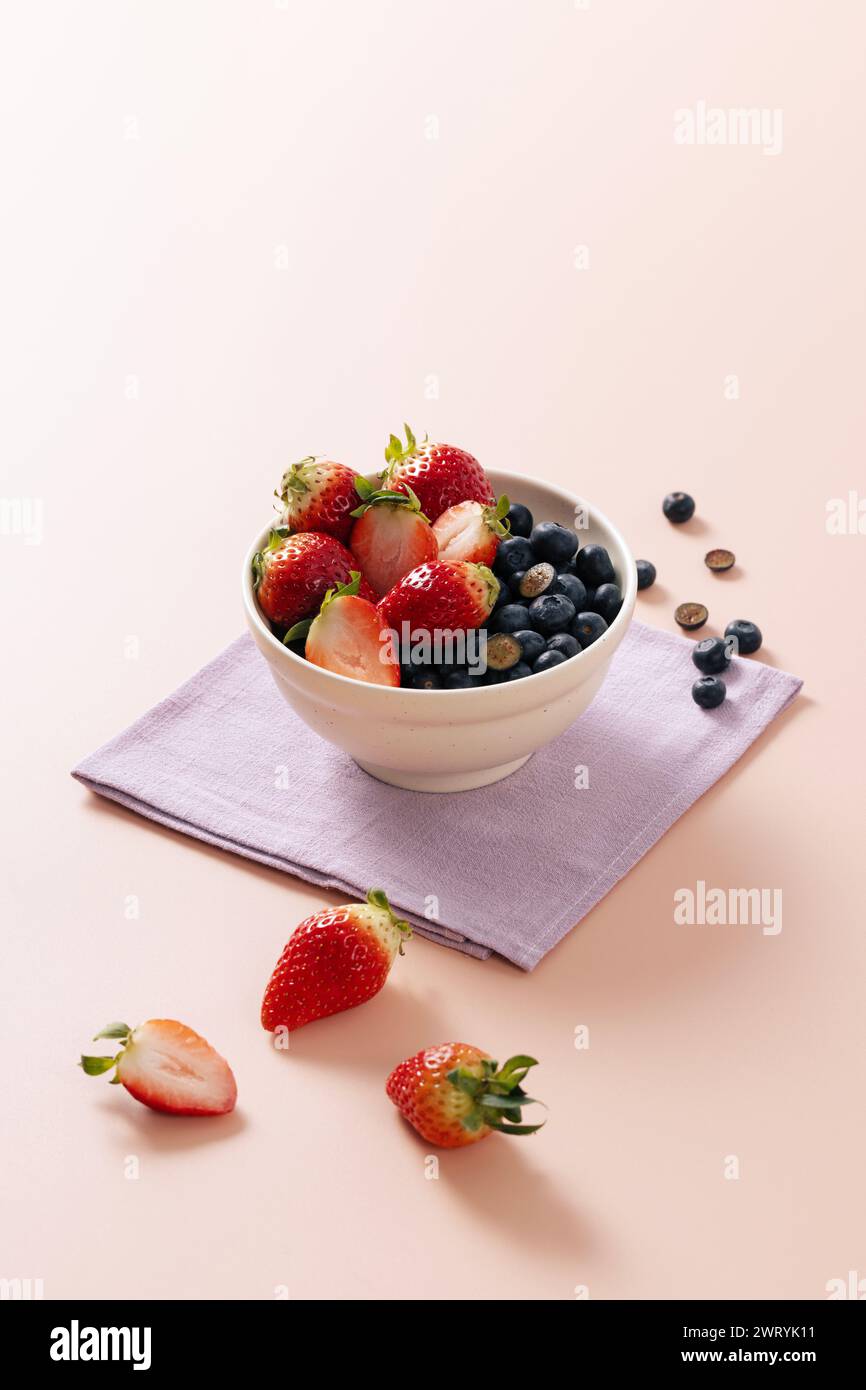 a bowl of cherries and blueberries Stock Photo