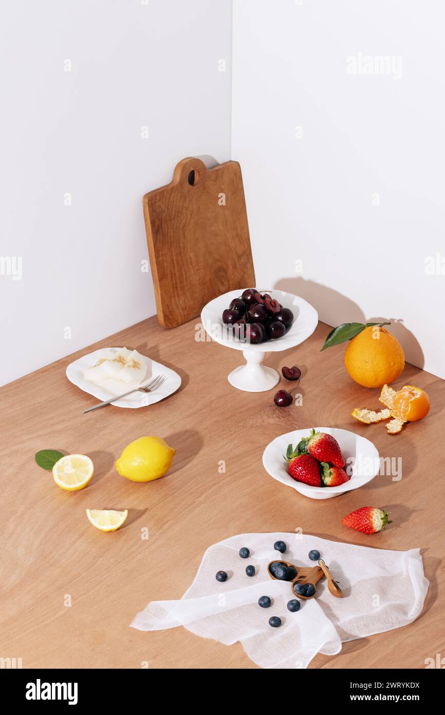 Fruit in the background of a wooden table. A delicious table setting Stock Photo