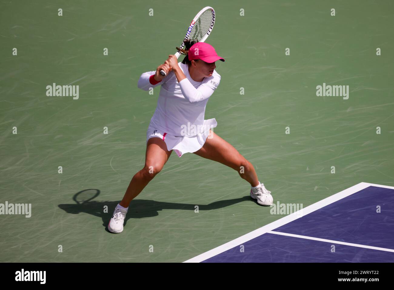 March 14, 2024 Iga Swiatek of Poland returns a shot against Caroline