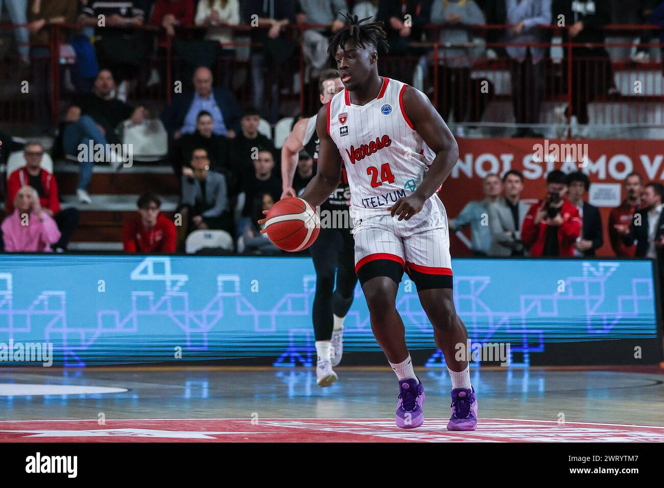 Varese, Italy. 13th Mar, 2024. Elisee Assui #24 of Itelyum Varese seen in action during the FIBA Europe Cup 2023/24 Quarter-Finals game between Itelyum Varese and Era Nymburk at Itelyum Arena. Final score; Itelyum Varese 91:76 Era Nymburk Credit: SOPA Images Limited/Alamy Live News Stock Photo