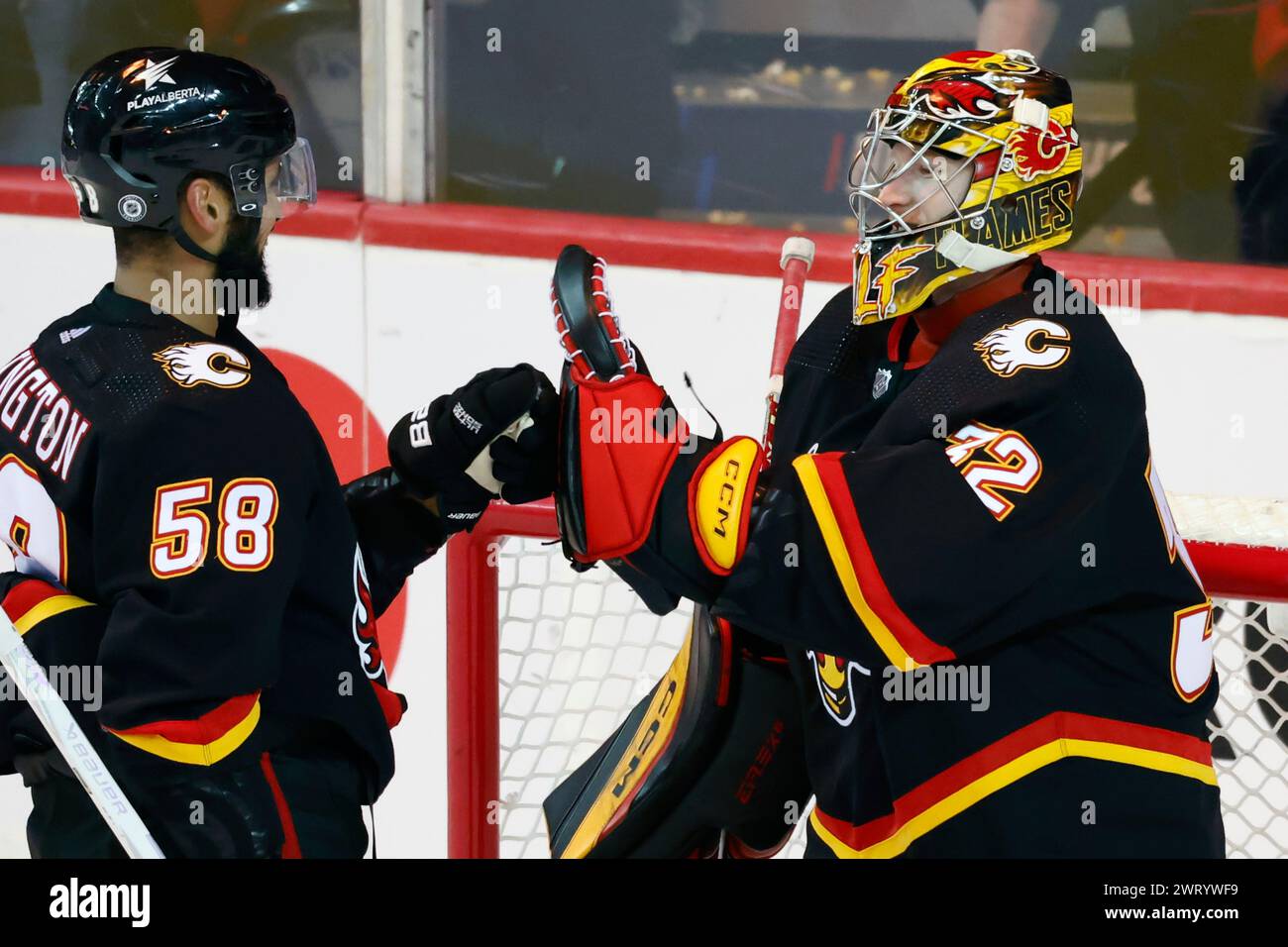 Calgary Flames Goalie Dustin Wolf Celebrates With Oliver Kylington ...