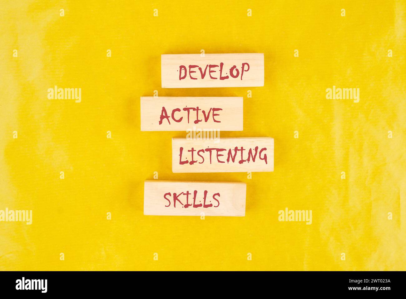Concept word Develop active listening skills on wooden blocks on a ...