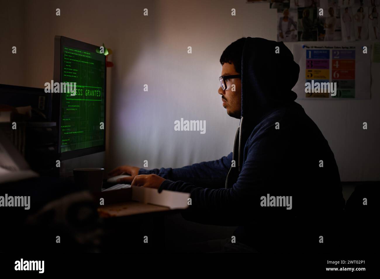 Programming, computer and man with hacker, night or cyber security with online database, malware or password phising. Person, IT programmer or Stock Photo
