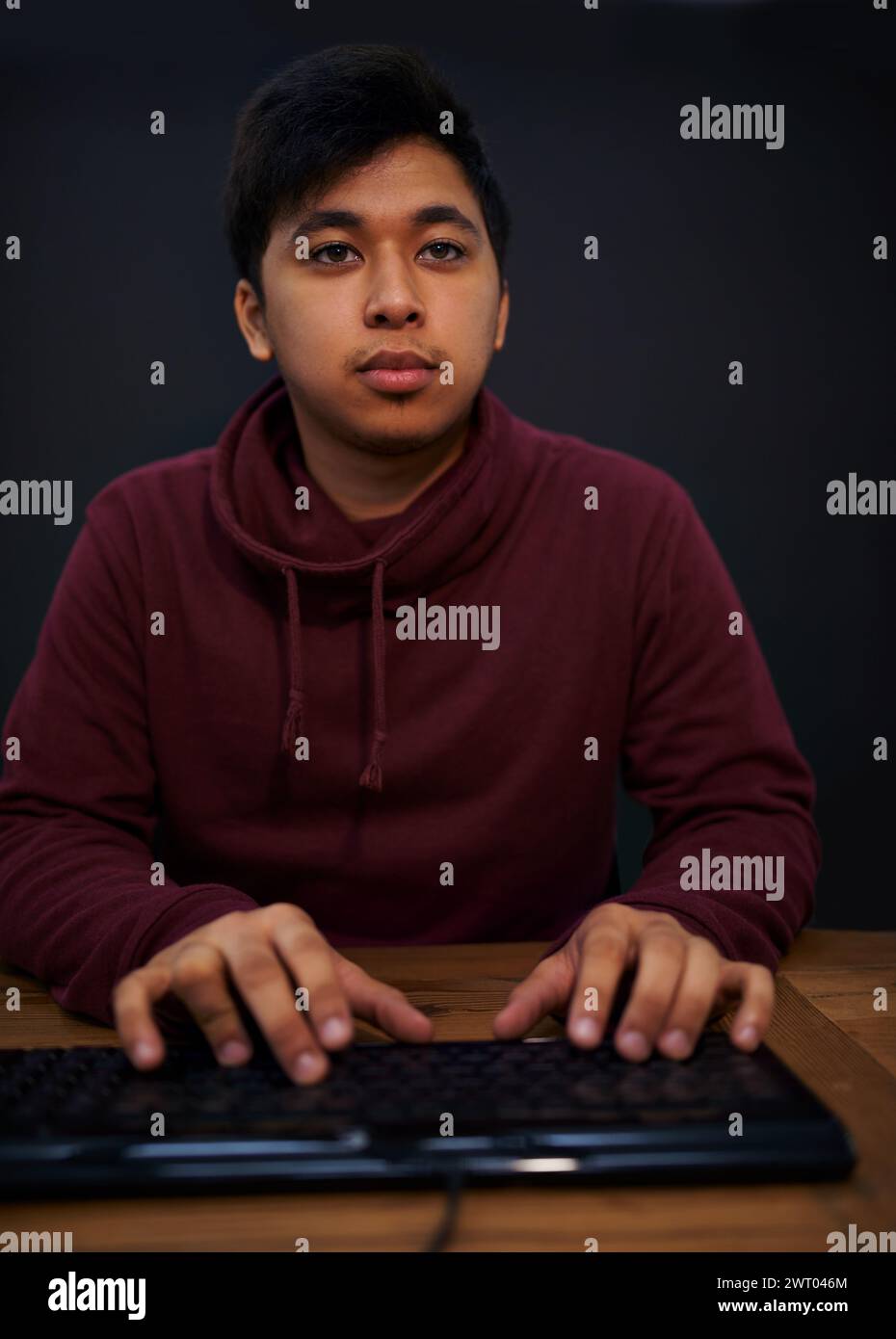Asian man, face and keyboard for coding, programmer and information ...