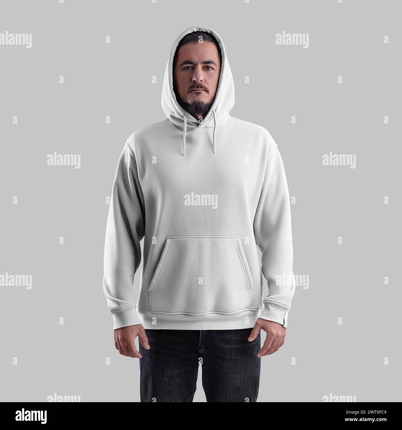 Mockup of white hoodie on bearded man in hood, oversized clothes with pocket, laces, label, for design, branding, front. Fashion sweatshirt template i Stock Photo