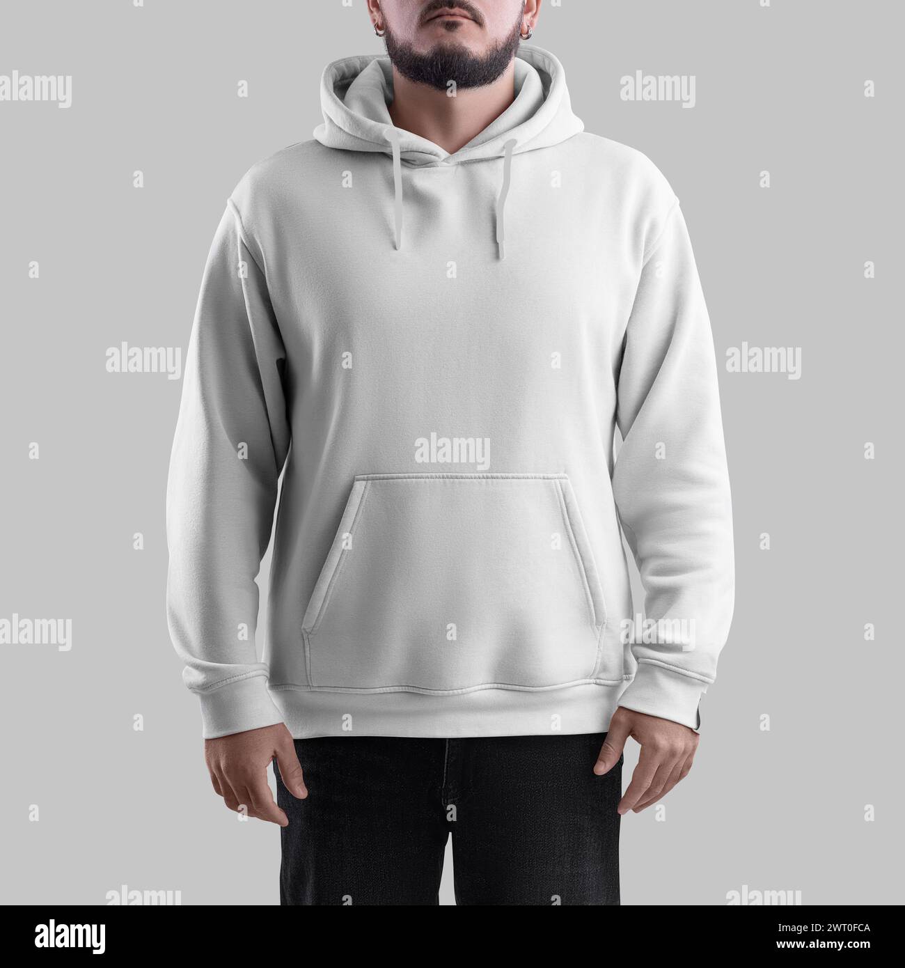 White hoodie mockup on bearded man, oversized sweatshirt with pocket, for design, branding, front view. Trendy casual clothes template isolated on bac Stock Photo