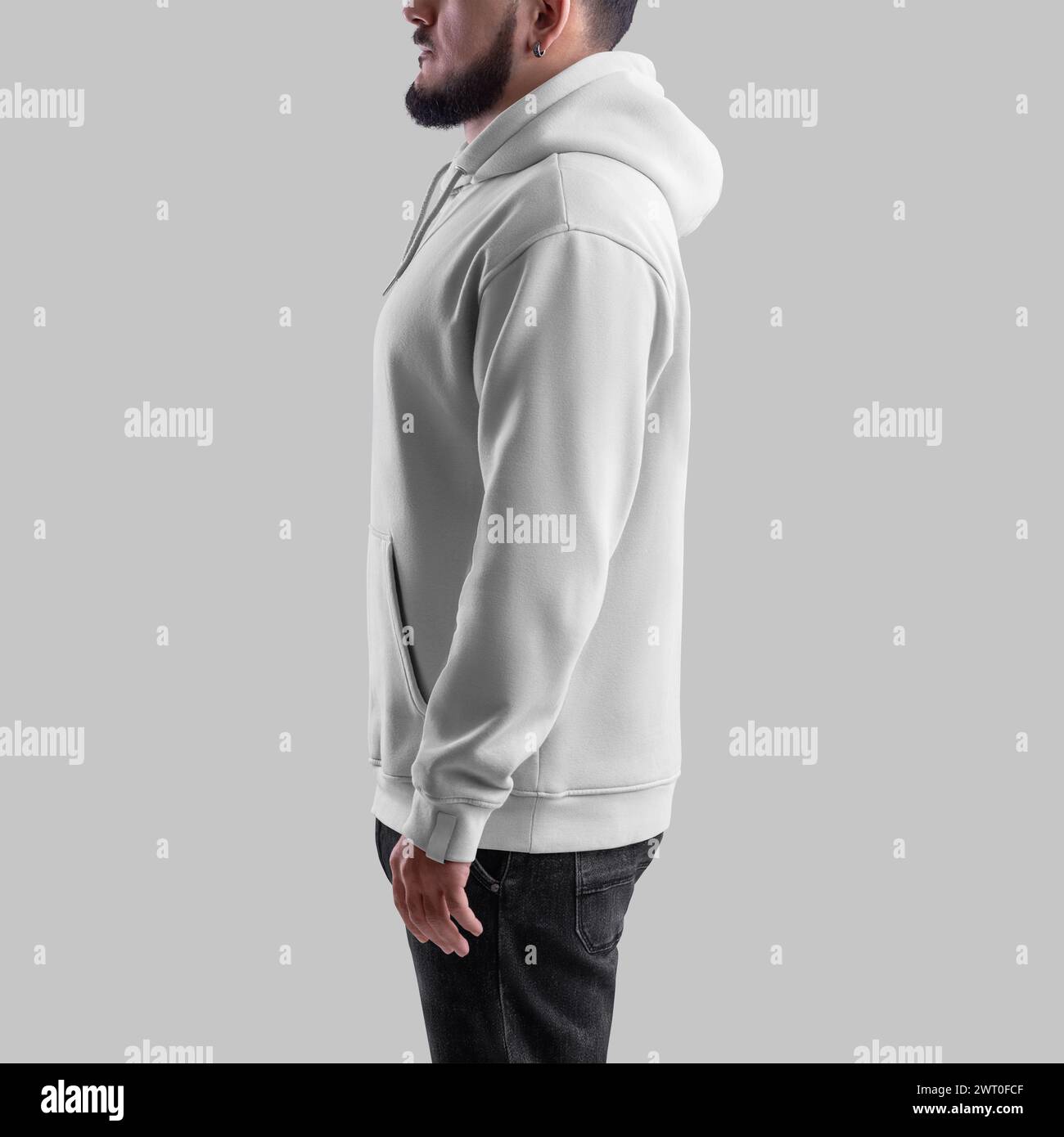Oversized white hoodie template on bearded man, side view, textile apparel with pocket, laces, label for design. Mockup of a stylish male sweatshirt. Stock Photo
