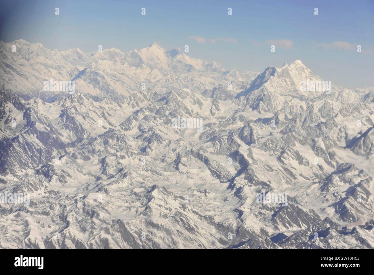 Wide panorama of snow-covered mountain ranges from the air, impressions from the great panoramic flight along the Himalayan giants, the roof of the Stock Photo