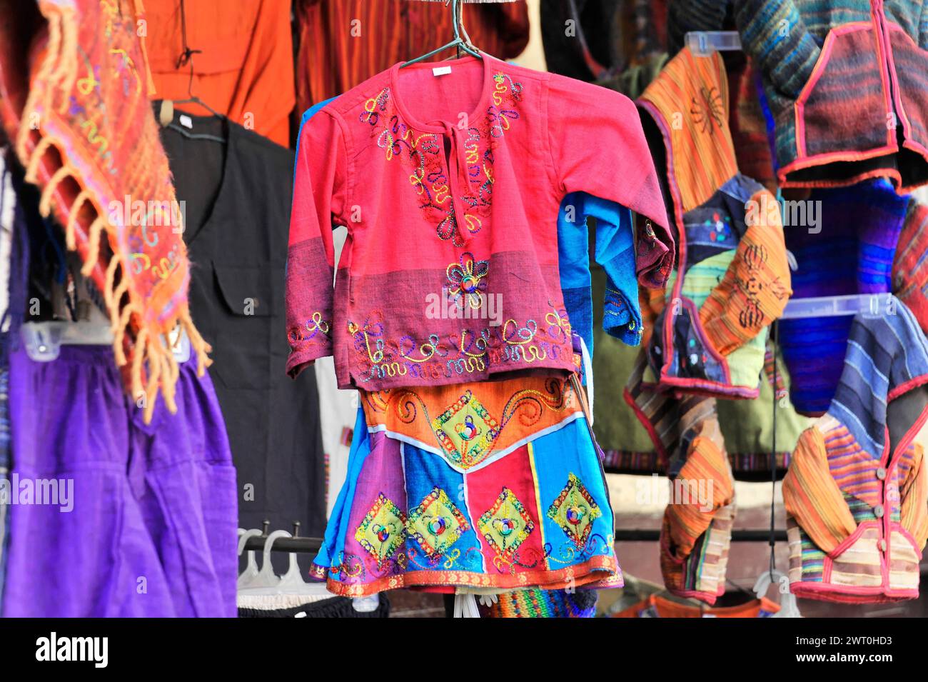 Colourful traditional clothing with embroidery at a market stall, Impressions of Nepal, Kathmandu Nepal Stock Photo