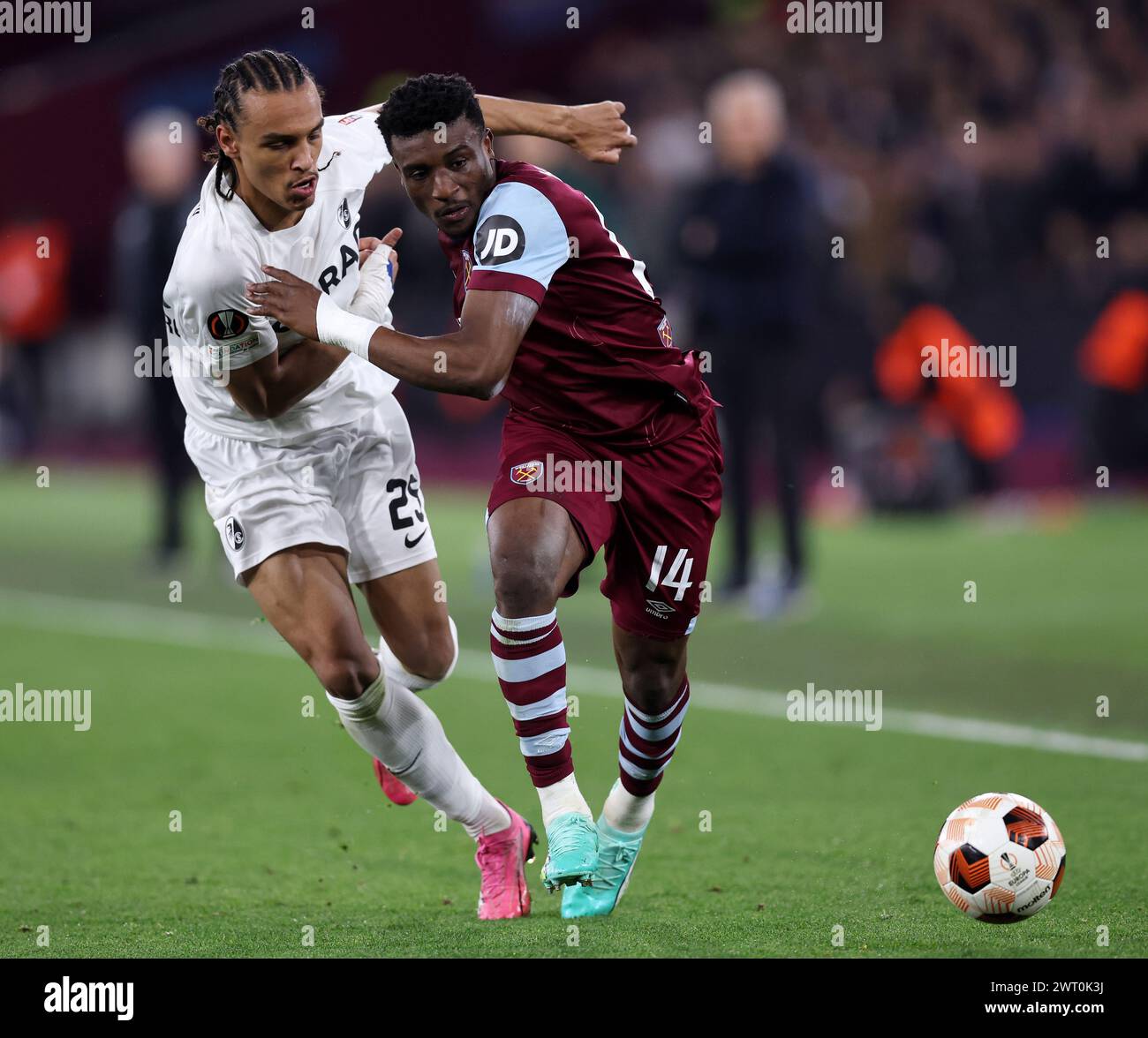 London, UK. 14th Mar, 2024. West Ham United's Mohammed Kudus with SC Freiburg's Kiliann Sildillia during the UEFA Europa League Round of 16 match at the London Stadium, London. Picture credit should read: David Klein/Sportimage Credit: Sportimage Ltd/Alamy Live News Stock Photo