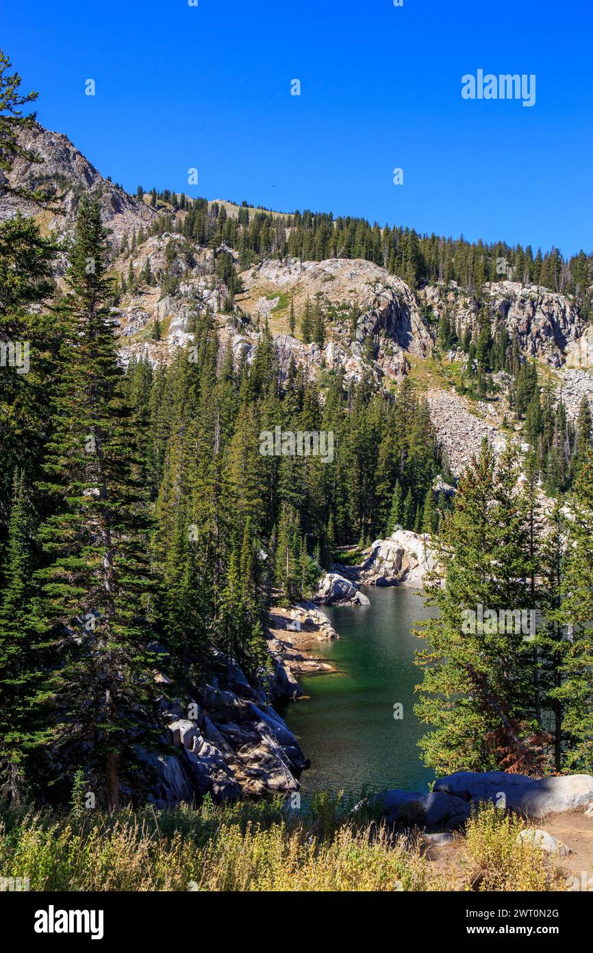 Secluded Lake Martha Nestled in Granite Cliffs and Evergreen Forests Stock Photo