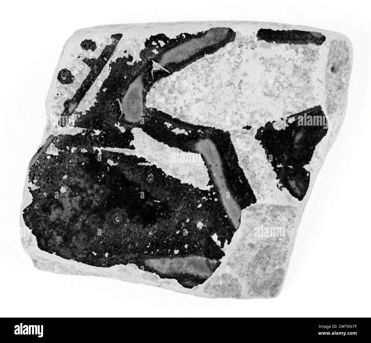 Attic Red-Figure Column Krater Fragment. Unknown 5th century B.C. From upper part of body (lower section of band of tongues running across shoulder just visible). Surface worn and difficult to decipher. Interior, black with broad reserved band. Stock Photo