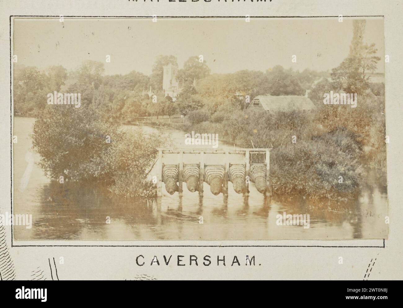 Caversham. Henry W. Taunt, photographer (British, 1842 - 1922) 1897 One of three tipped-in photographs illustrating a printed map of Mapledurham, Purley, Reading, and the surrounding area along the River Thames. The photograph shows a view of the river at Caversham, with a row of eel bucks standing in the river between the riverbank and a small island. Houses are visible on the riverbanks in the background. (Recto, mount) lower center, below image, printed in black ink: 'CAVERSHAM.' Stock Photo