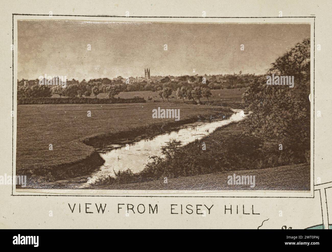 View from Eisey Hill. Henry W. Taunt, photographer (British, 1842 - 1922) about 1886 One of three tipped-in photographs illustrating a printed map of Castle Eaton, Kempsford, and the surrounding area along the River Thames. The photograph shows a view of the river cutting through a field near Cricklade, with a view of the tower from the Church of St. Sampson visible over the trees in the distance. (Recto, mount) lower center, below image, printed in black ink: 'VIEW FROM EISEY HILL' Stock Photo