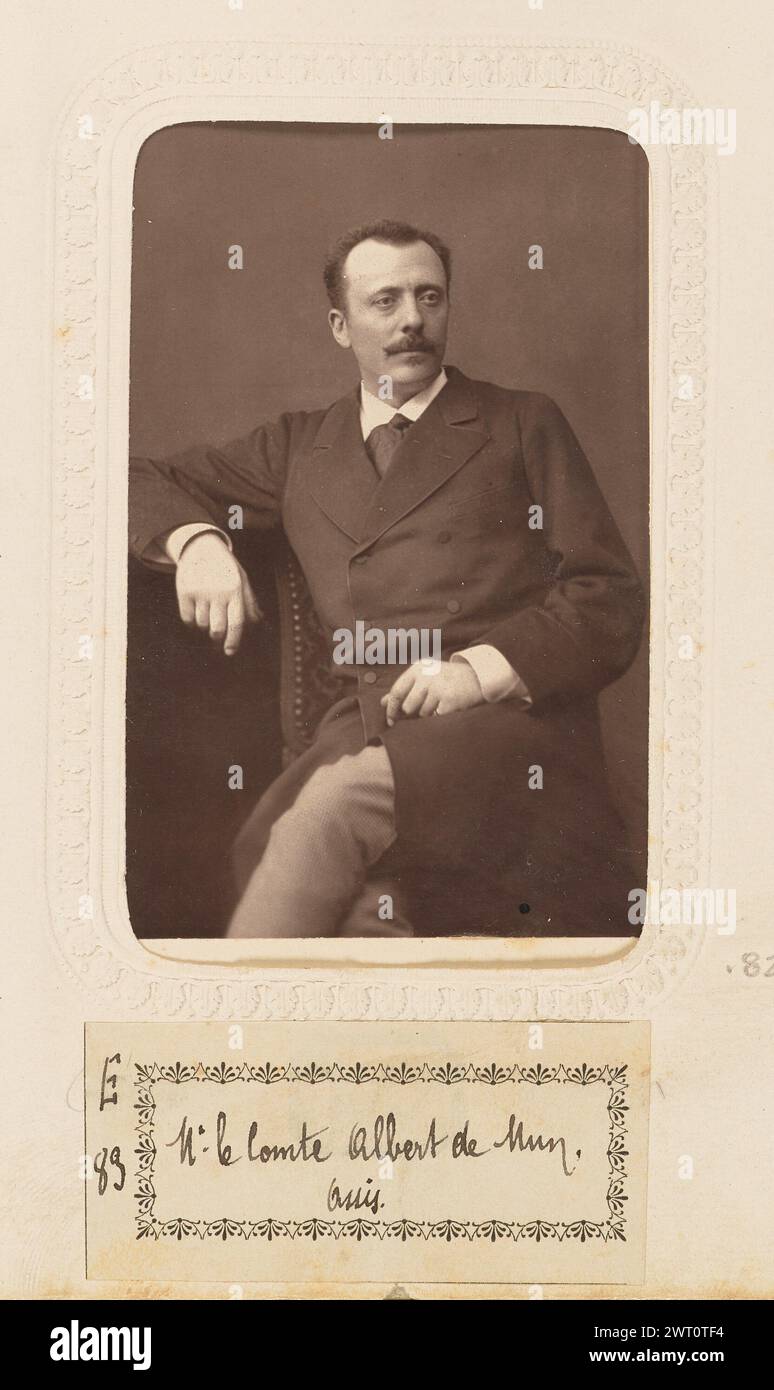 Monsieur le Comte de Mun. Bertall & Cie., photographer about 1870–1879 A portrait of Adrien Albert Marie, Comte de Mun. He is seated with his legs crossed and one arm resting on a small table or pedestal. He has short dark hair and a mustache. (Recto, mount) upper center, black imprinted text: 'BERTALL & CIE PHOT.'; lower center, black imprinted text: 'ME. LE CTE. DE MUN'; (Verso, mount) center, black maker's imprint: 'PHOTOGRAPHIE/BERTALL/& CIE/RUE BOISSY D'ANGLAS.33./Ancienne Rue de la Madeleine.'; (Recto, album page) lower center, below image, black ink on white paper label: 'E/83 [space] M Stock Photo