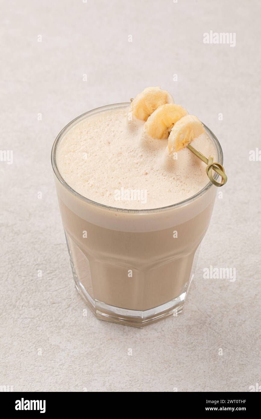 Glass of raf coffee with dried banana Stock Photo