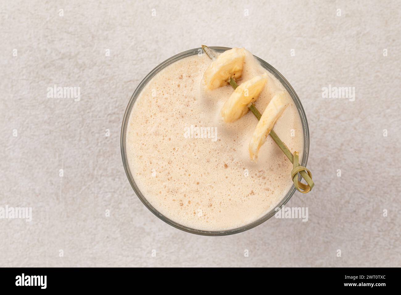 Glass of raf coffee with dried banana Stock Photo