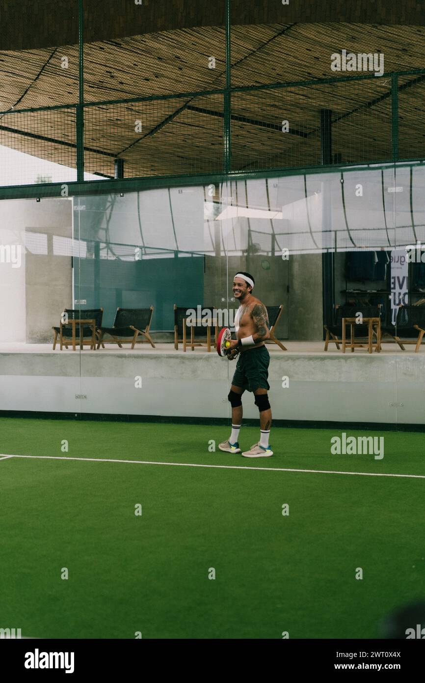 Man play padel tennis on an indoor court, Bali. Stock Photo