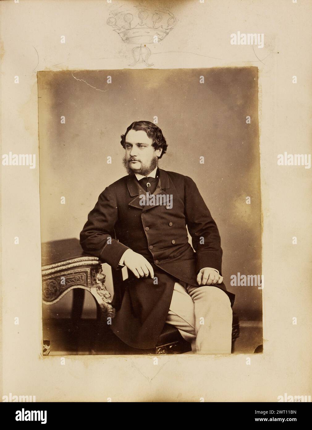Charles Anderson-Pelham, 3rd Earl of Yarborough. Unknown, photographer about 1864 A portrait of Charles Anderson-Pelham, 3rd Earl of Yarborough. He is seated and resting one arm on a small table. His legs are crossed. There is a sketch of a crown on the album page above the portrait. Stock Photo