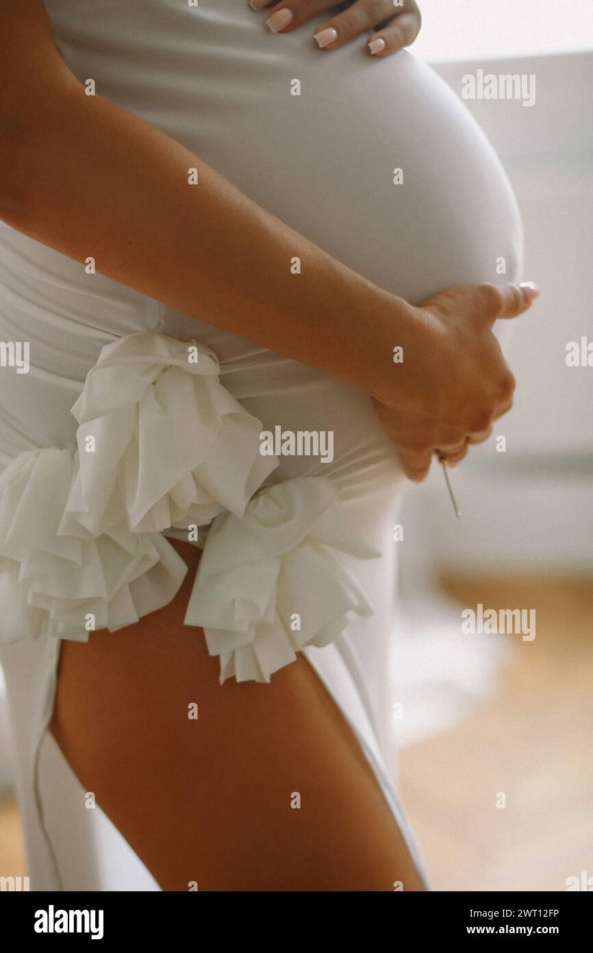 Close up photo of pregnant belly. Stylish Motherhood concept Stock Photo