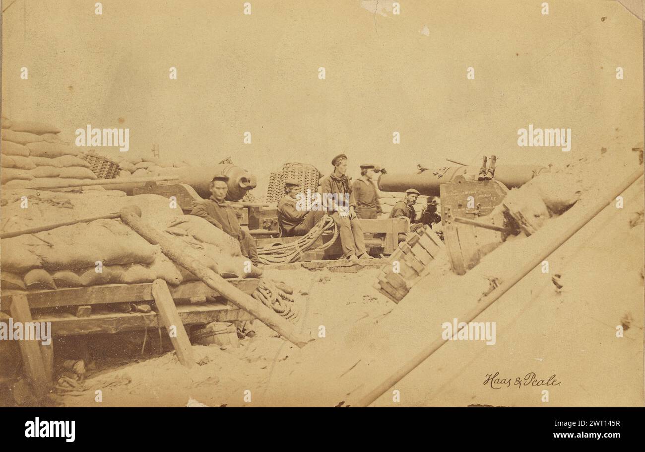 Naval Battery. Haas & Peale, photographer (American, active 1846 - 1867) 1863 Several sailors seated on top of equipment with parrott rifles seen around them. Palettes stacked with sandbags are visible in the foreground. (Recto, sheet) lower center, light green ink: 'Photo by Haas & Peale Morris Island & Hilton Head S.C.'; (Recto, sheet) lower right, letterpress label in black ink: 'No.1. - Naval Battery./ Two 80-pounder Whitworths. Breaching battery against Sumter.'; (Verso, sheet) upper right, notation in pencil: '17-'; Stock Photo