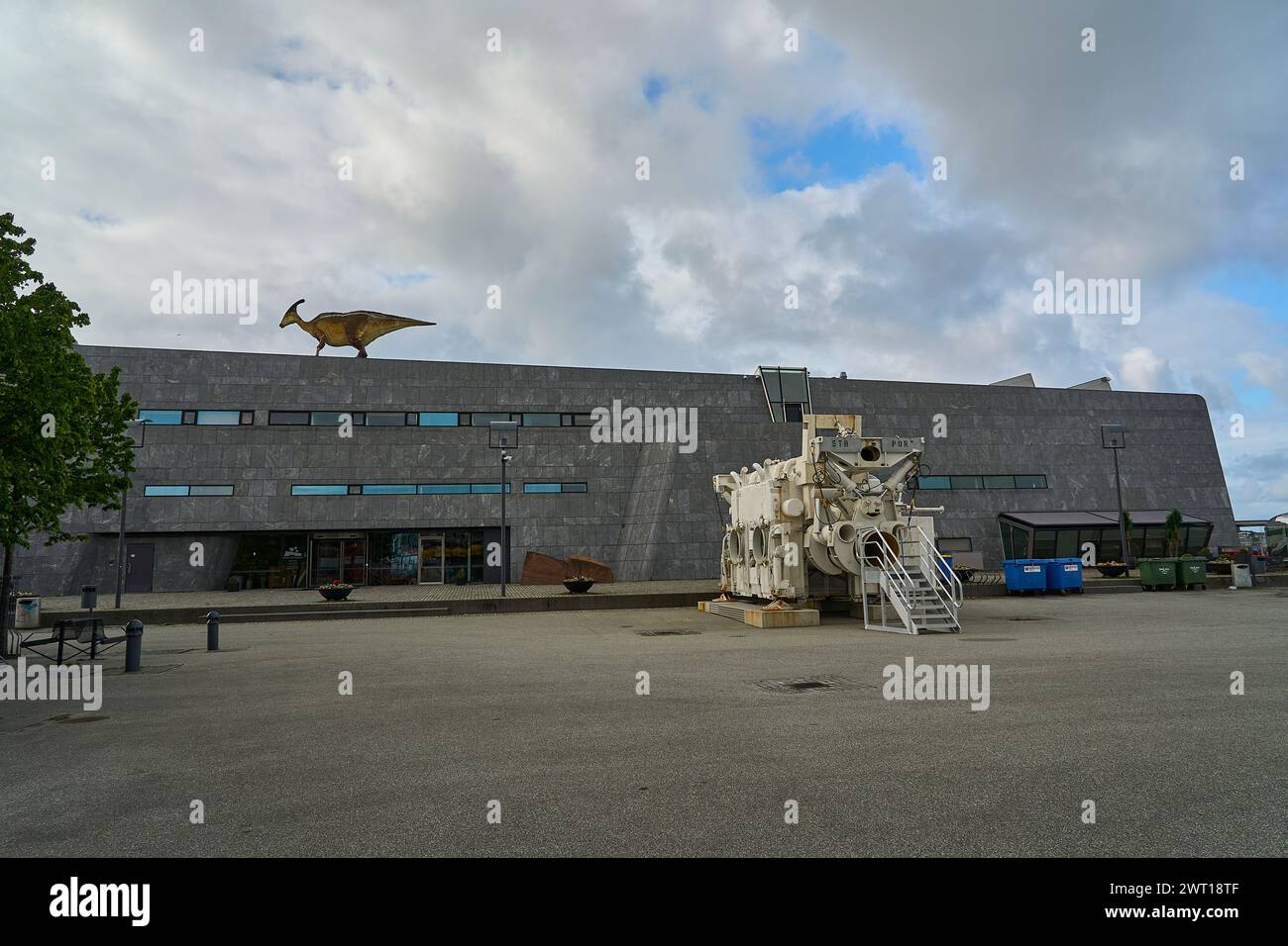 Stavanger, Norway - 05 29 2022: Norwegian Petroleum Museum with oil drilling equipment in the front and a dinosaur on the roof. Stock Photo