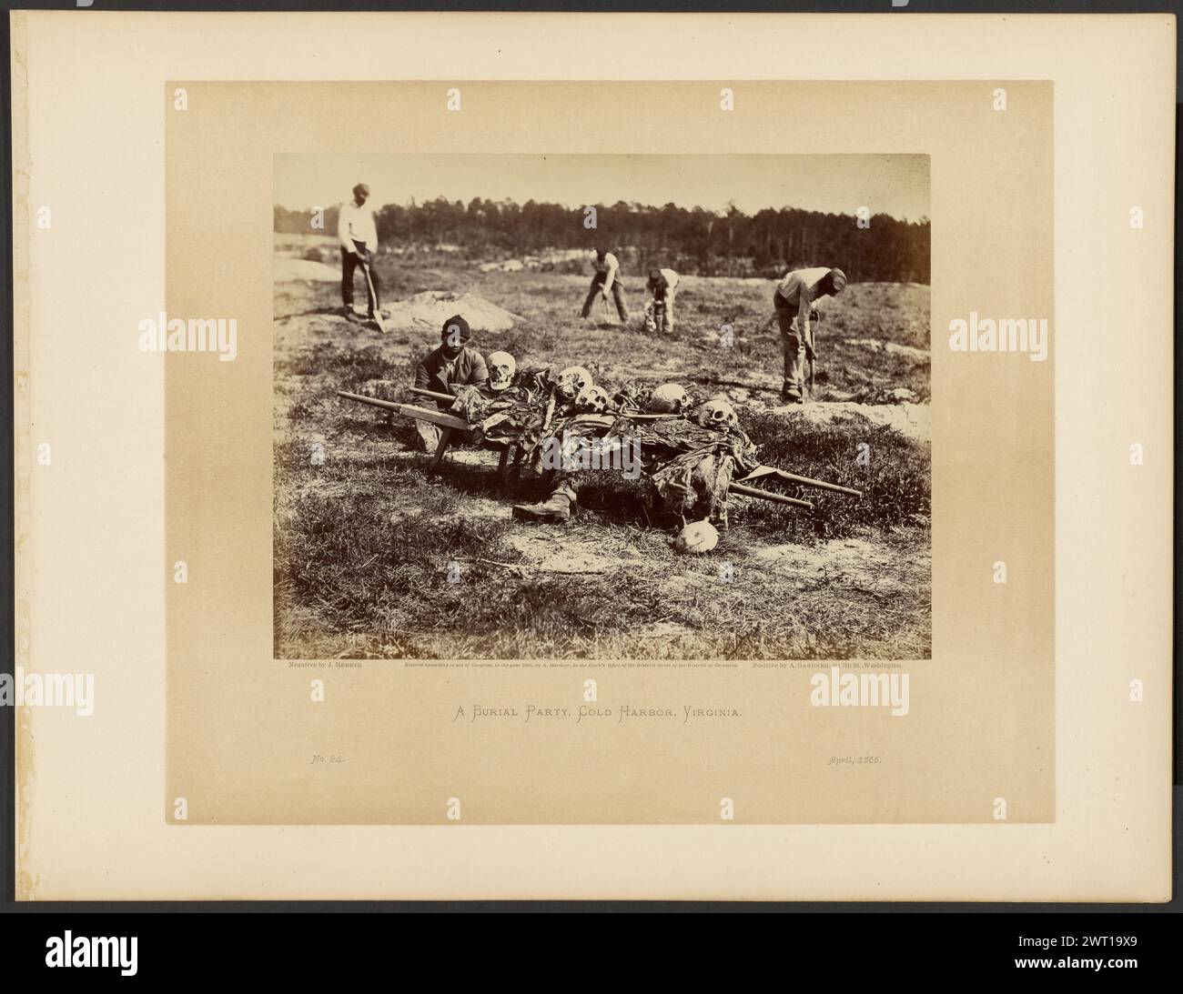 A Burial Party, Cold Harbor, Virginia. John Reekie, photographer (American, active 1860s) Print by Alexander Gardner, maker (American, born Scotland, 1821 - 1882) April 1865 This gruesome scene depicts the unpleasant job of burying the remains of fallen Union soldiers from the June 1864 battles of Gaines' Mill and Cold Harbor. This task has fallen to a group of black men doing the menial work while a white man standing at upper left acts as overseer. The man seated in the center, next to the stretcher laden with human parts, looks directly at the camera, revealing no emotion that can be reconc Stock Photo