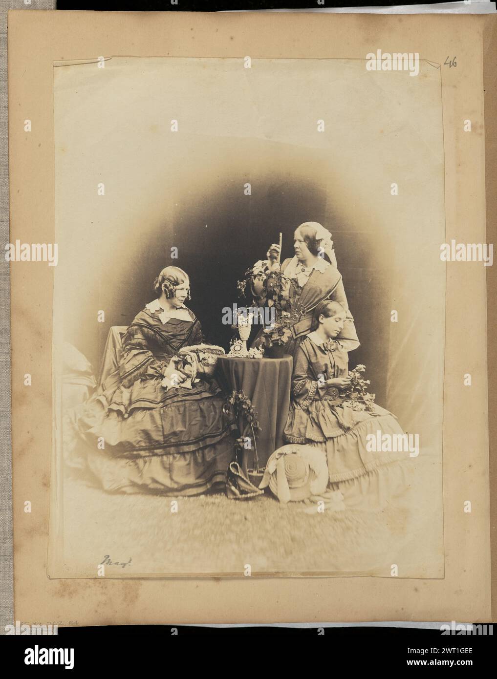 Three Women with Flowers. Unknown, photographer 1840s–early 1850s A posed composition of three women clustered around a small table. Two women are holding flowers, and a plant sits by the foot of the third woman. (Recto) lower left, in pencil: 'Mag't.'; (Verso) center, in pencil: 'Mary Rigg/ Margaret Rigg/ Mary Haymes'; (Recto, mount) upper right, in pencil: '46'; Stock Photo