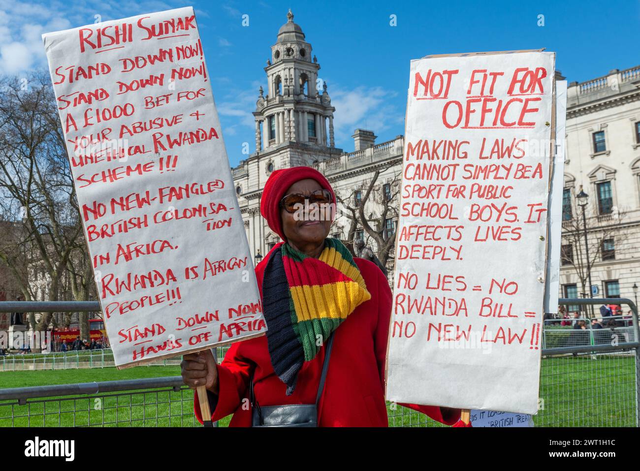 Protester outside Parliament protesting against the Rwanda Bill, Safety of Rwanda (Asylum and Immigration) Bill. Rishi Sunak stand down. £1000 bet Stock Photo