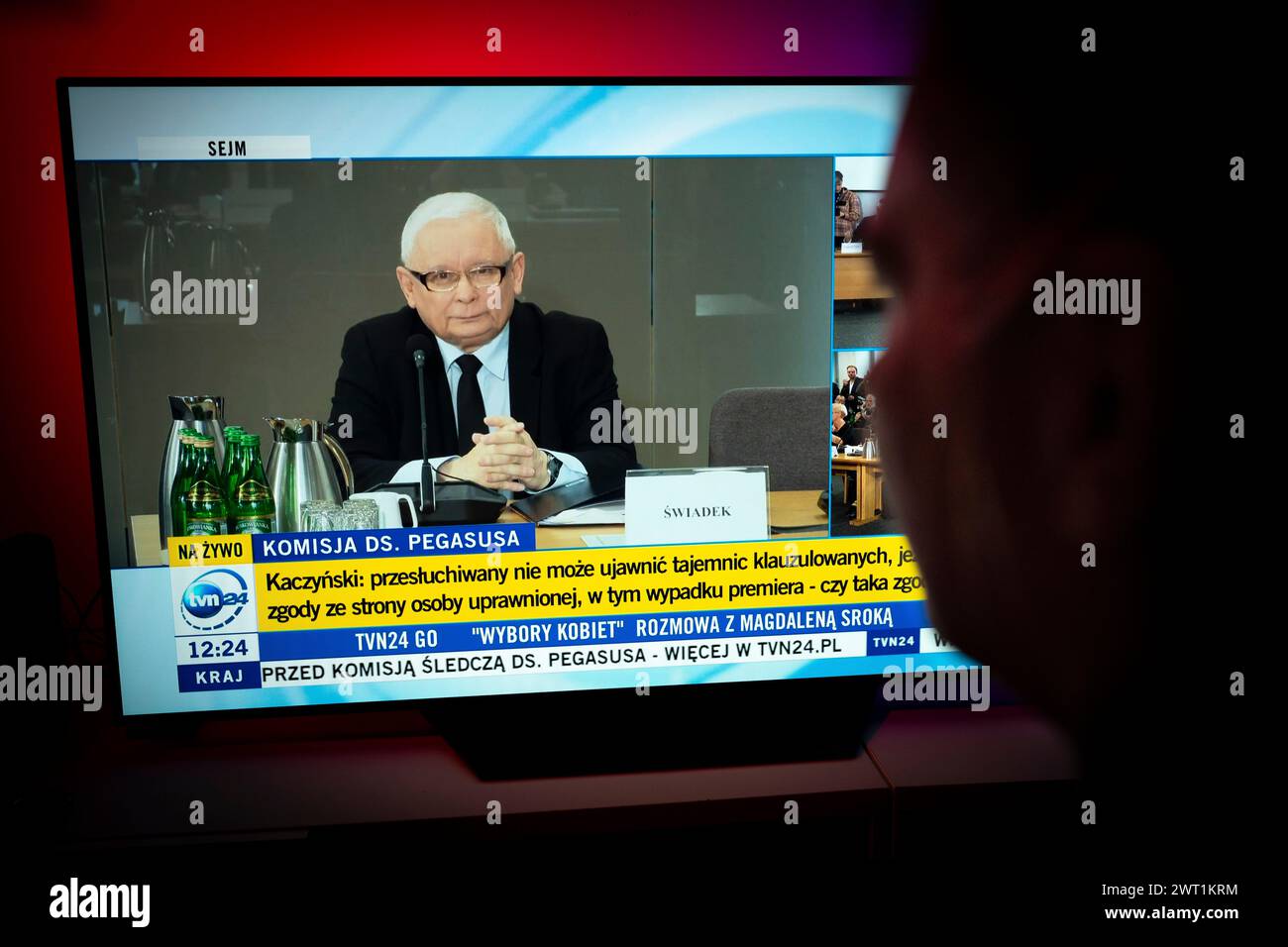 Warsaw, Poland. 15th Mar, 2024. A woman is seen wathcing the televised testimony of Jaroslaw Kaczynski at the Pegazus inquiry committee on 15 March, 2024. Former heads of governmant are being probed for their alleged invvolvement into illegal surveillance with the use of Israeli Pegazus software, a case in which opposition government officials and even members of the Law and Justice party were being spied on without proper legal consent. (Photo by Jaap Arriens/Sipa USA) Credit: Sipa USA/Alamy Live News Stock Photo